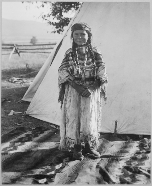 lossy-page1-491px-Angelic_La_Moose,_whose_grandfather_was_a_Flathead_chief,_wearing_costume_her_mother_made,_full-length,_standing,_in_fro_-_NARA_-_519156.tif